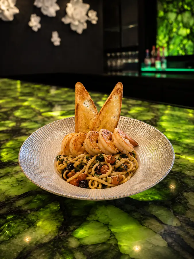 Shrimp pasta with vibrant greens and Mediterranean-inspired flavors